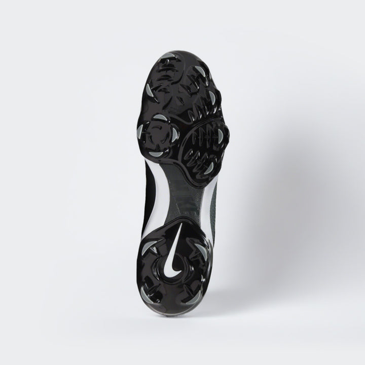 Nike Force black baseball shoes, bottom view of sole and cleats with white swoosh