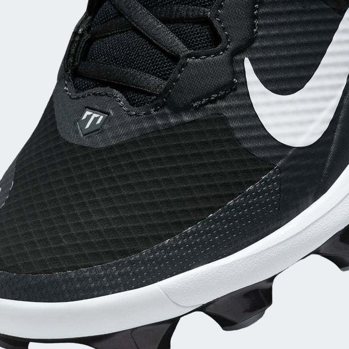 Nike Force black baseball shoe, close-up of upper material and white swoosh logo