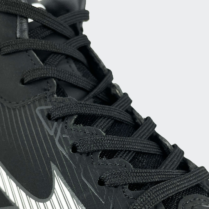Mizuno black and white baseball shoe, close-up of laces and upper design